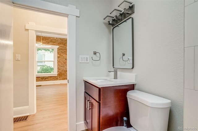 575 N Marion St, Denver, CO 80218 - half bath featuring wood finished floors and vanity
