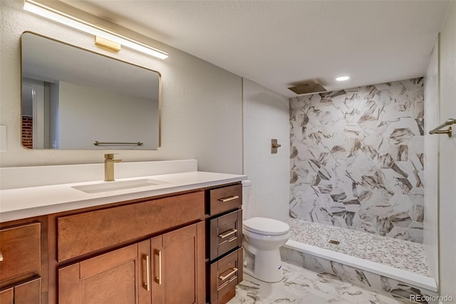 575 N Marion St, Denver, CO 80218 - bathroom featuring vanity, tiled shower, marble finish flooring, and recessed lighting
