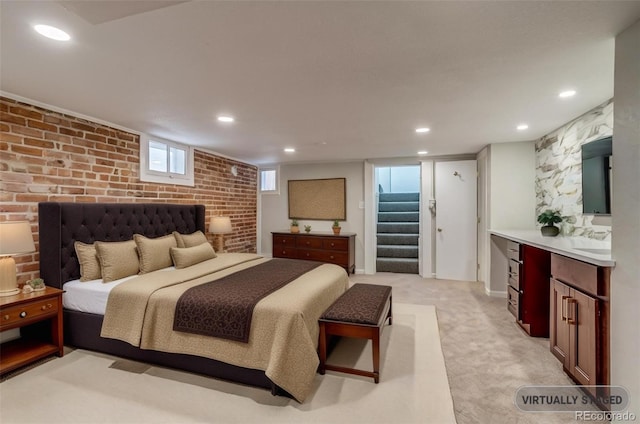 575 N Marion St, Denver, CO 80218 - bedroom featuring light colored carpet, recessed lighting, and brick wall