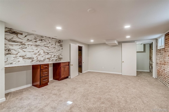 575 N Marion St, Denver, CO 80218 - finished below grade area with light colored carpet, built in desk, and recessed lighting