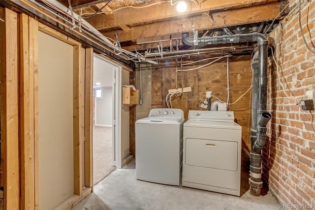 575 N Marion St, Denver, CO 80218 - laundry room featuring washing machine and dryer and brick wall