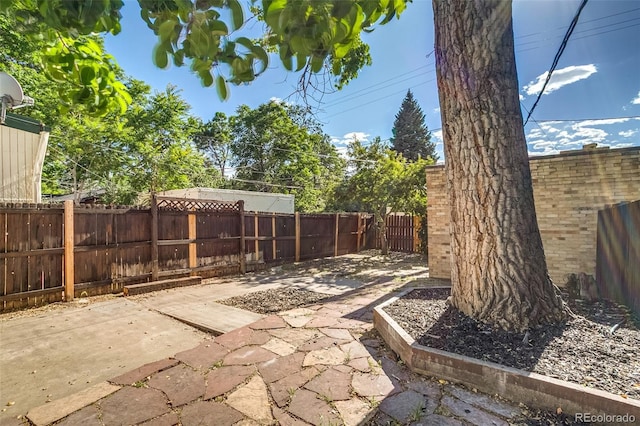 575 N Marion St, Denver, CO 80218 - fenced backyard featuring a patio