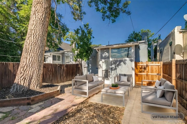 575 N Marion St, Denver, CO 80218 - fenced backyard with an outdoor hangout area and a patio