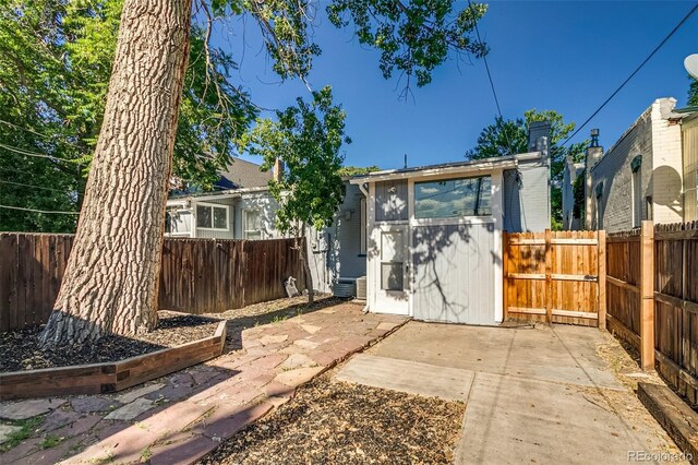 575 N Marion St, Denver, CO 80218 - rear view of house featuring a patio area and a fenced backyard