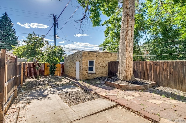 575 N Marion St, Denver, CO 80218 - fenced backyard featuring a patio