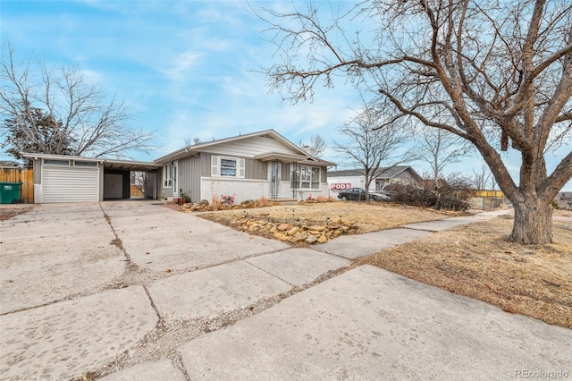 ranch-style home featuring a carport