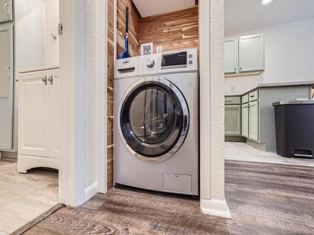 washroom featuring washer / dryer and light wood-type flooring