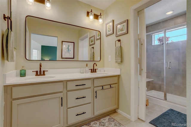 bathroom featuring vanity, walk in shower, and tile patterned floors