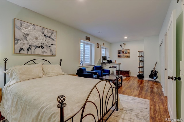 bedroom with hardwood / wood-style floors