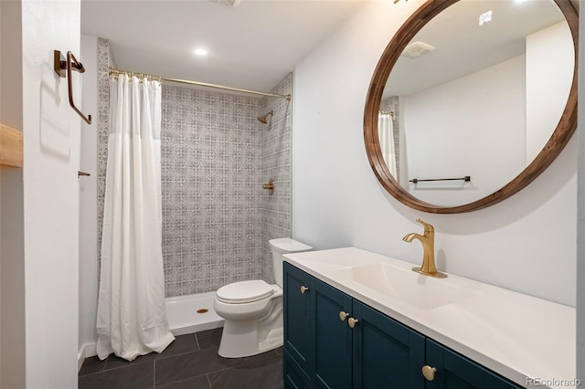 bathroom with curtained shower, tile patterned floors, vanity, and toilet