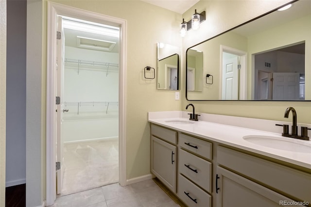 bathroom featuring tile patterned flooring and vanity