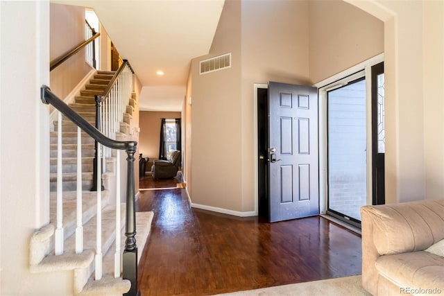 foyer entrance featuring dark wood-type flooring