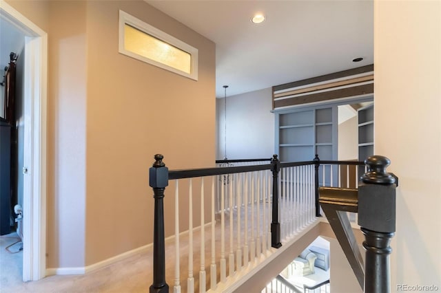 hallway featuring carpet flooring