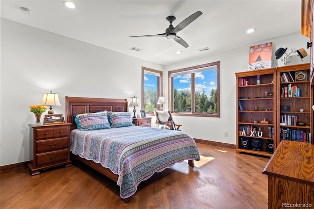 bedroom with hardwood / wood-style floors and ceiling fan