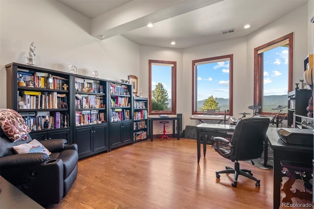 office area with light hardwood / wood-style floors