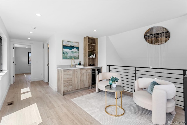 357 S Franklin St, Denver, CO 80209 - indoor wet bar featuring beverage cooler, light wood-style flooring, recessed lighting, and baseboards