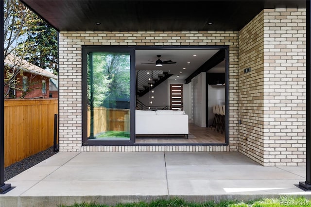 357 S Franklin St, Denver, CO 80209 - view of exterior entry featuring brick siding and a ceiling fan