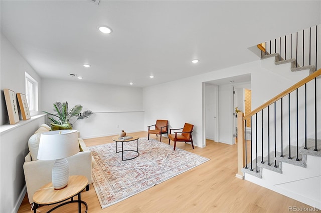 6498 S Everett Way, Littleton, CO 80123 - living area featuring light wood-type flooring, stairs, and recessed lighting