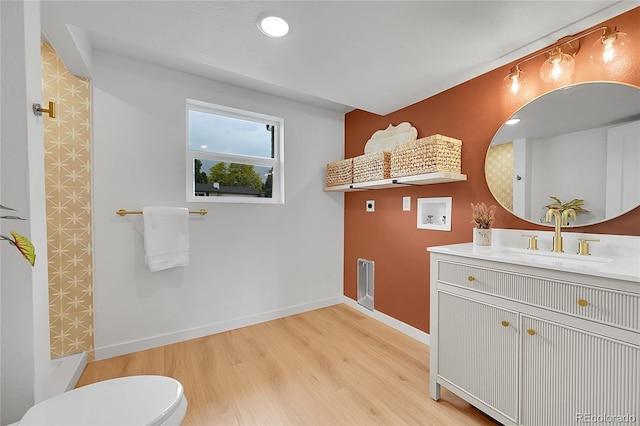 6498 S Everett Way, Littleton, CO 80123 - full bathroom with vanity, wood finished floors, and a shower