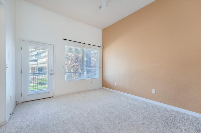 spare room with light colored carpet