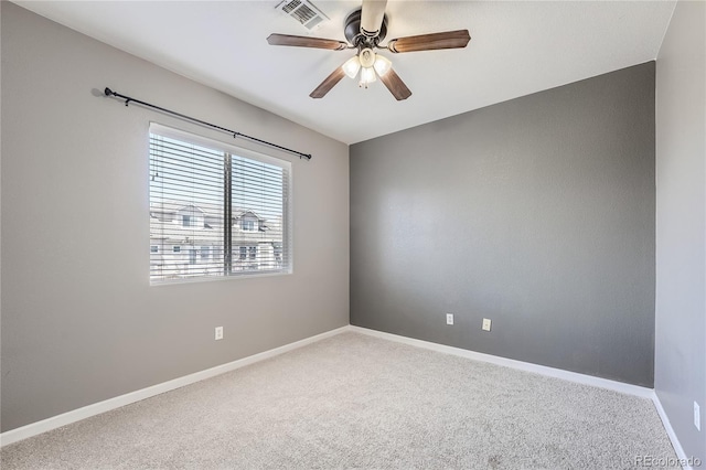 empty room featuring ceiling fan and carpet flooring