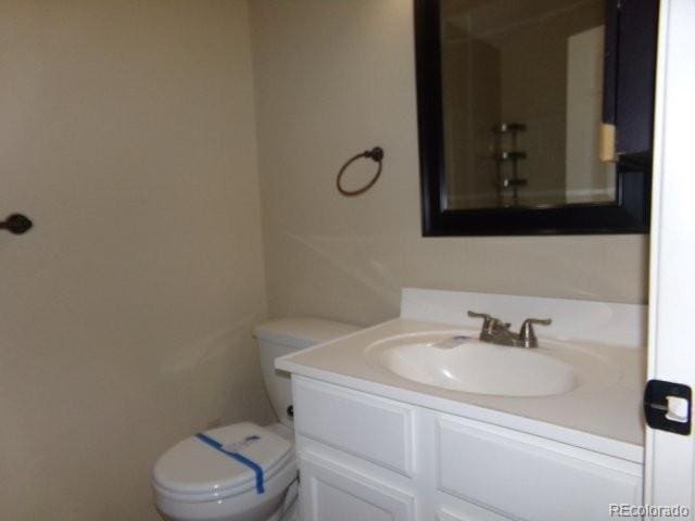 bathroom with vanity and toilet