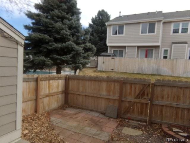 view of patio / terrace featuring a gate and fence