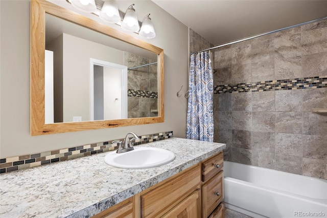 bathroom with shower / tub combo and vanity