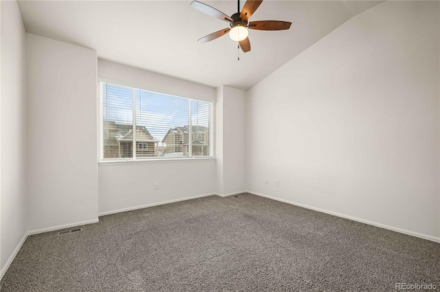 carpeted empty room featuring ceiling fan and lofted ceiling