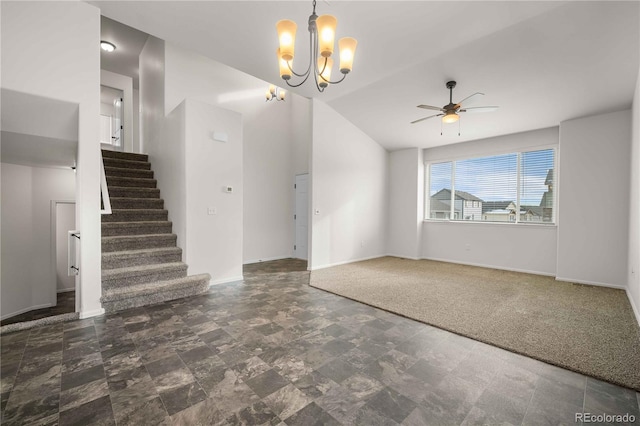 unfurnished living room with lofted ceiling and ceiling fan with notable chandelier