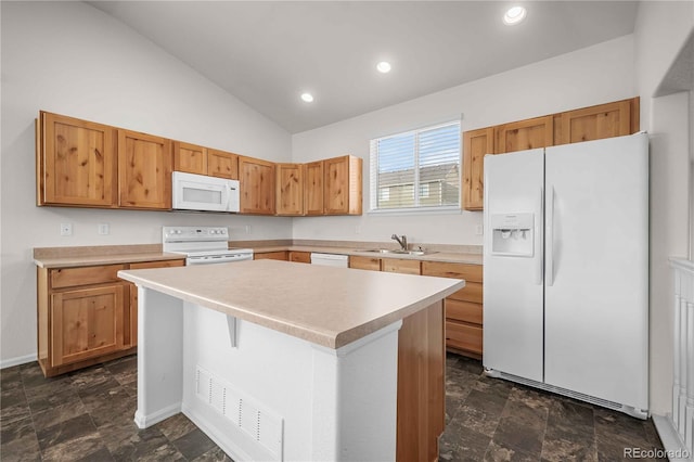 kitchen with vaulted ceiling, sink, white appliances, and a center island