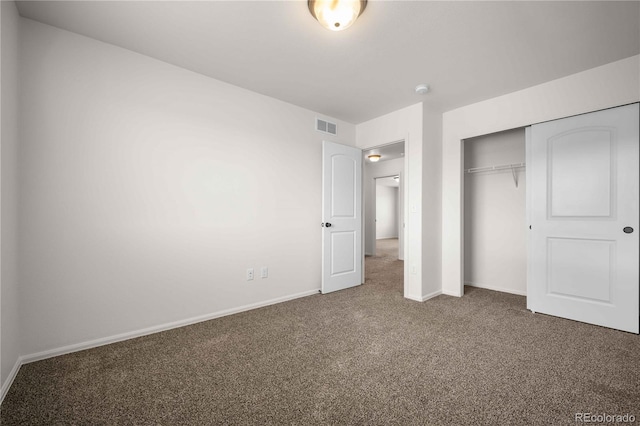 unfurnished bedroom featuring a closet and carpet floors