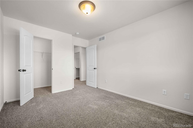 unfurnished bedroom featuring a closet and carpet