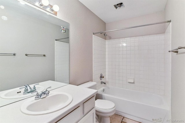 full bathroom featuring vanity,  shower combination, tile patterned floors, and toilet