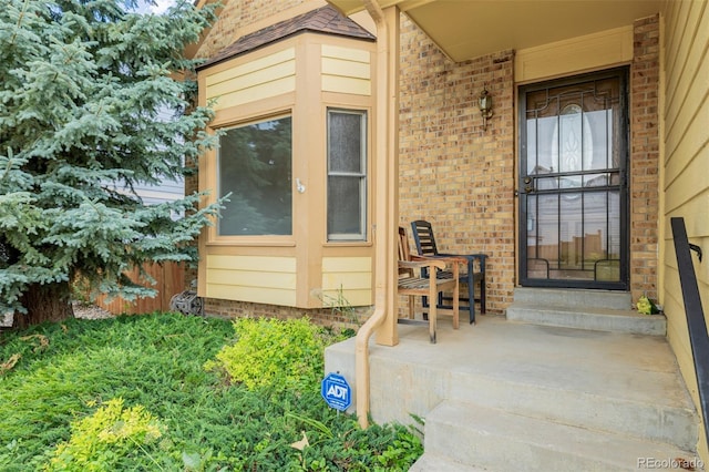 12319 W Burgundy Ave, Littleton, CO 80127 - entrance to property featuring brick siding