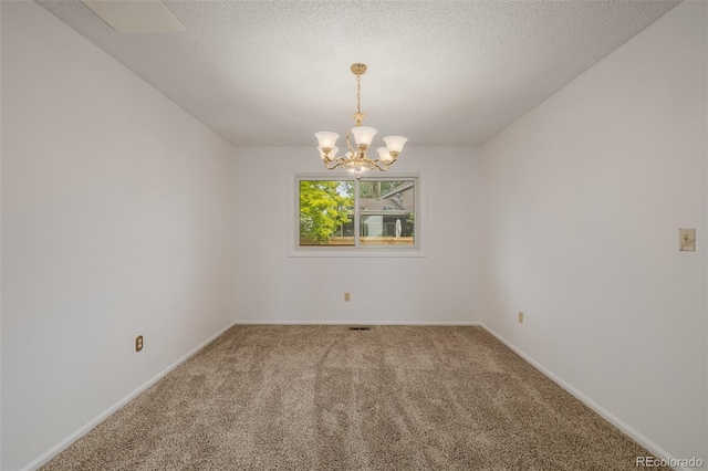12319 W Burgundy Ave, Littleton, CO 80127 - empty room featuring carpet floors, a chandelier, and a textured ceiling
