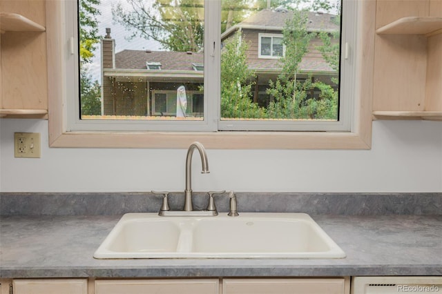 12319 W Burgundy Ave, Littleton, CO 80127 - detailed view of a sink and light brown cabinetry