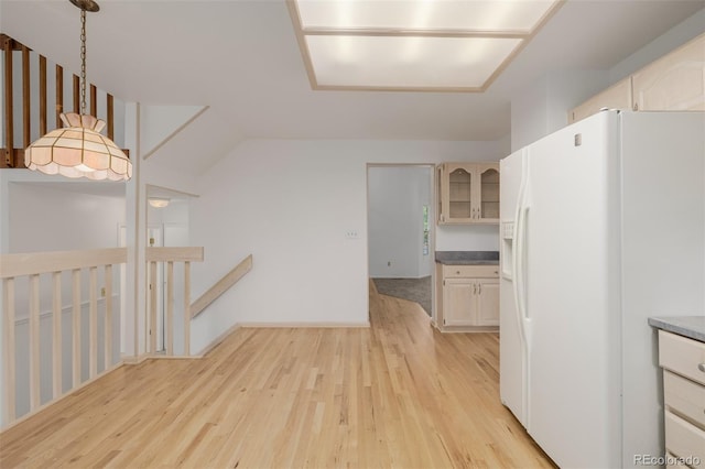 12319 W Burgundy Ave, Littleton, CO 80127 - kitchen with white refrigerator with ice dispenser, light wood-type flooring, and pendant lighting