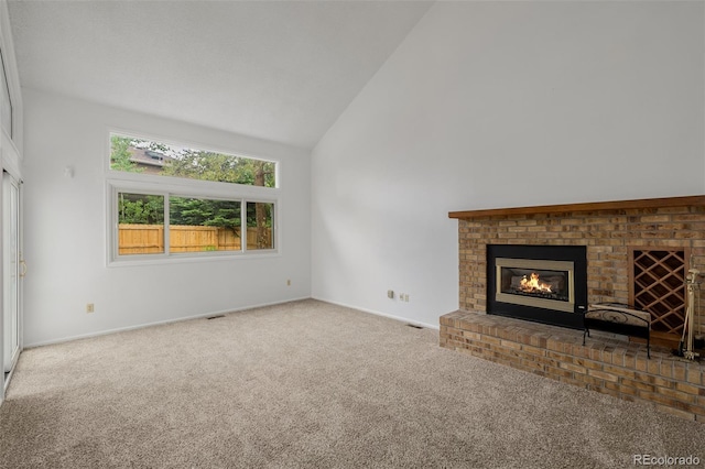 12319 W Burgundy Ave, Littleton, CO 80127 - unfurnished living room featuring carpet, high vaulted ceiling, and a fireplace
