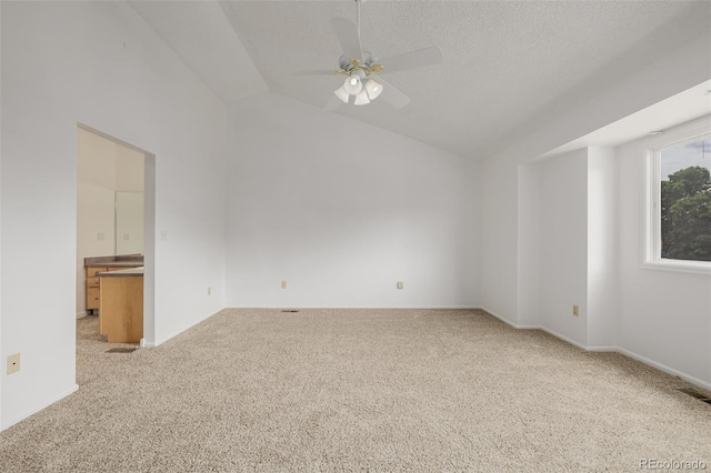 12319 W Burgundy Ave, Littleton, CO 80127 - empty room with light carpet, vaulted ceiling, and a ceiling fan