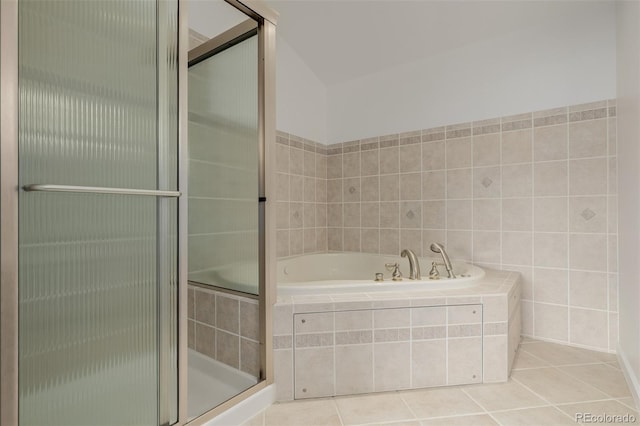 12319 W Burgundy Ave, Littleton, CO 80127 - bathroom featuring a bath, tile patterned flooring, and a stall shower
