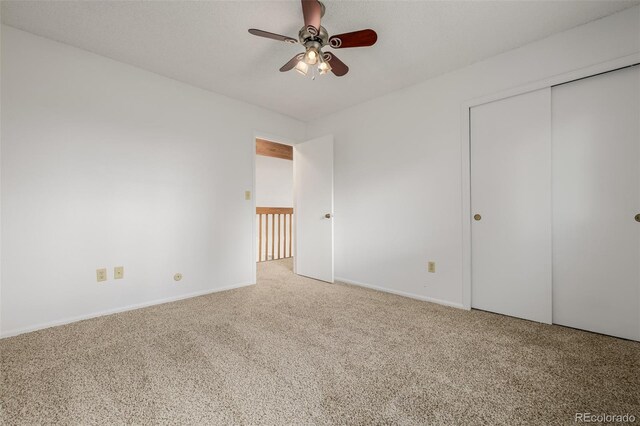 12319 W Burgundy Ave, Littleton, CO 80127 - unfurnished bedroom with carpet, a closet, and a ceiling fan