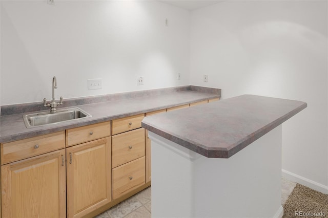 12319 W Burgundy Ave, Littleton, CO 80127 - kitchen with light brown cabinetry and a kitchen island
