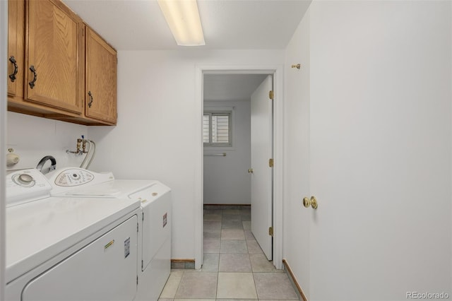 12319 W Burgundy Ave, Littleton, CO 80127 - washroom with cabinet space, light tile patterned flooring, and separate washer and dryer