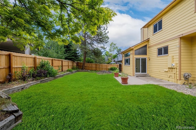 12319 W Burgundy Ave, Littleton, CO 80127 - fenced backyard with a patio
