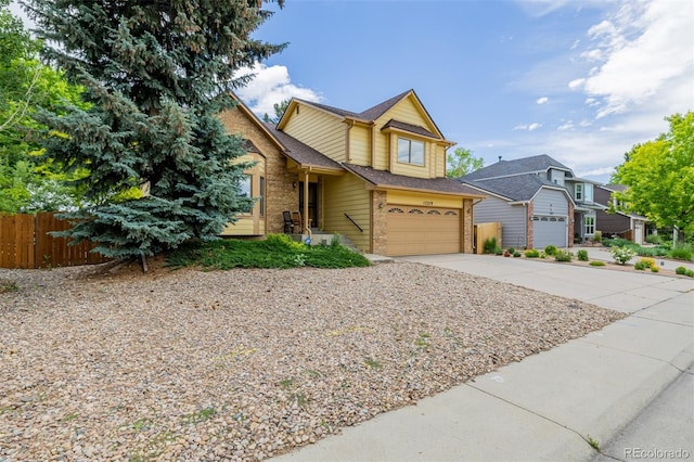 12319 W Burgundy Ave, Littleton, CO 80127 - traditional-style home with brick siding, driveway, and an attached garage