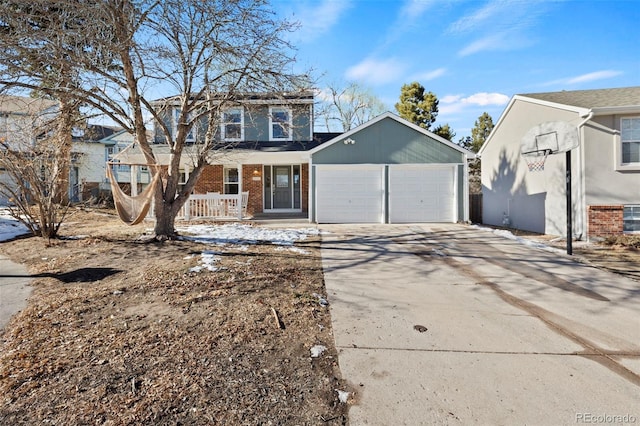 view of front of home featuring an attached garage, covered porch, concrete driveway, and brick siding