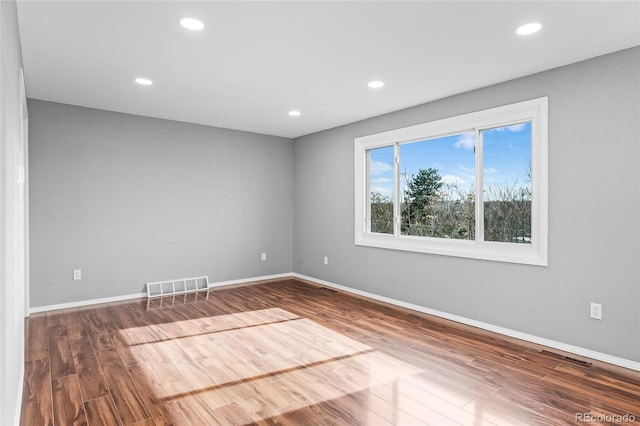 empty room with wood-type flooring