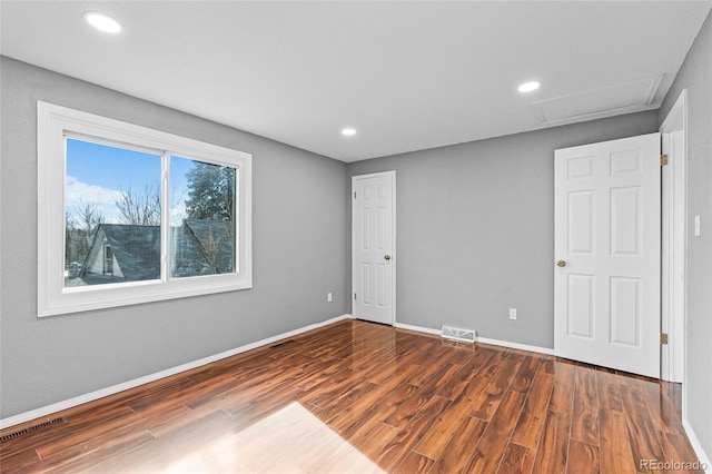 unfurnished room featuring dark hardwood / wood-style floors