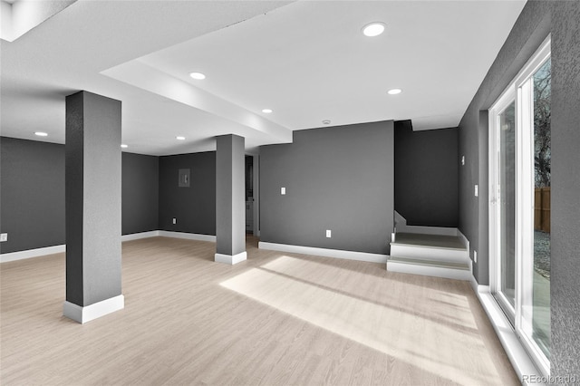 basement featuring light hardwood / wood-style flooring